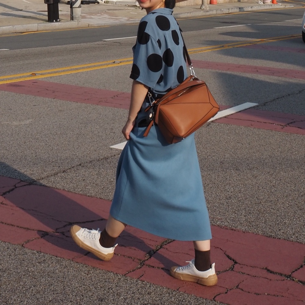 Blue polka dot shirt.